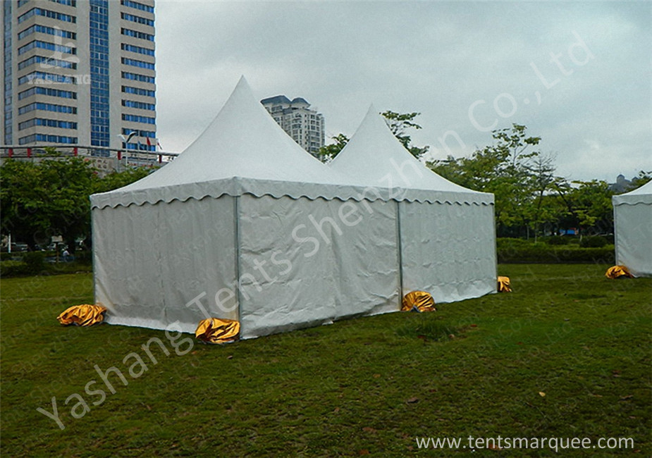 Fabric Cover and Aluminum Framed high peak marquees Setting up on the Grassland